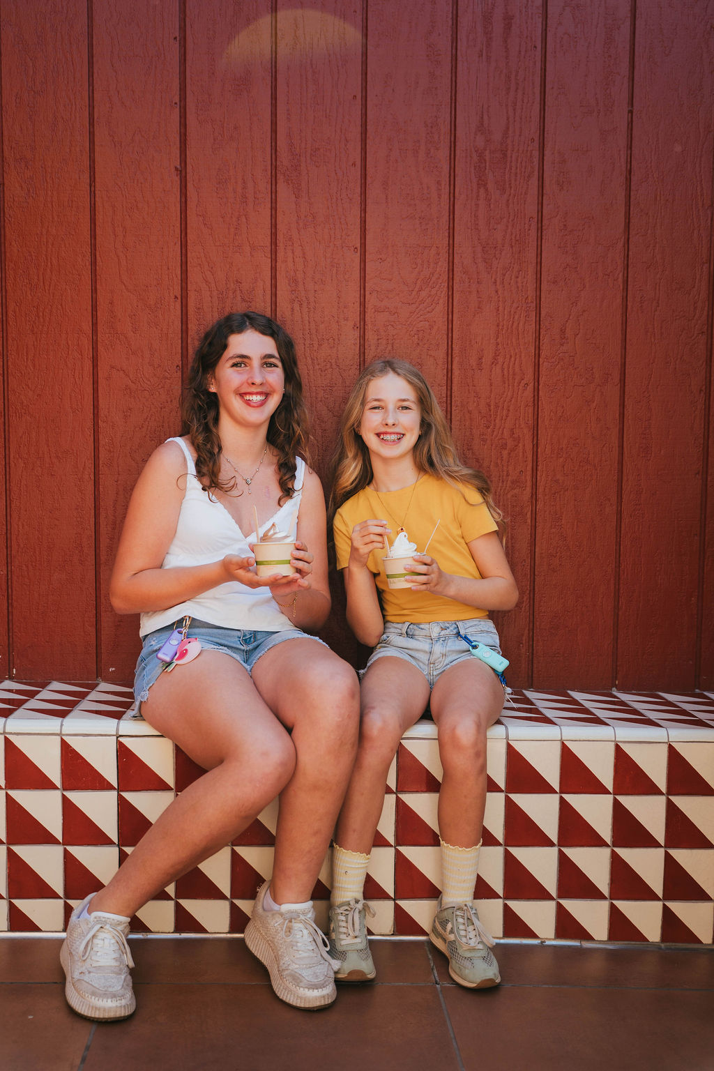Two women out together, each carrying a Birdie 3.0