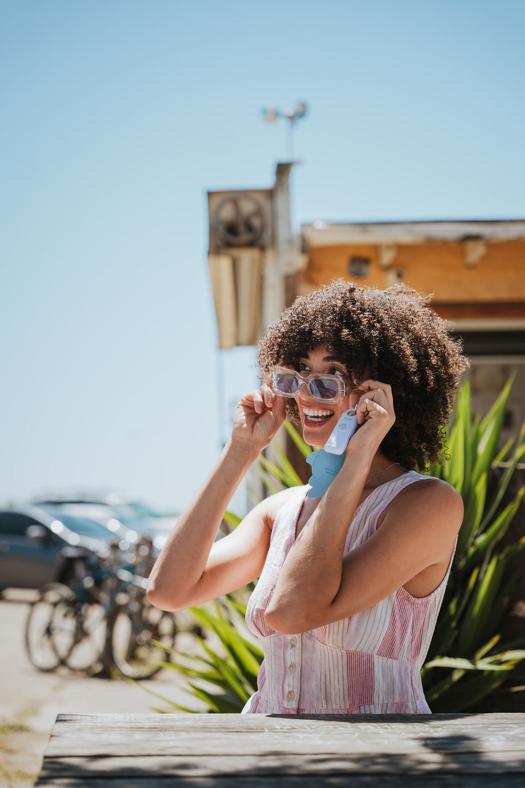 Woman carrying her Birdie 3.0 personal safety alarm, hands free